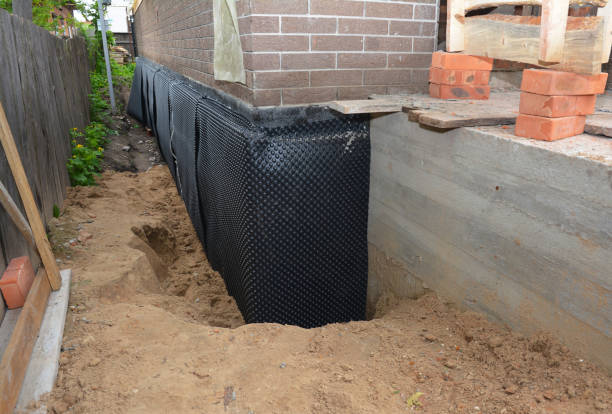 SJ Waterproofing Pros technician performing targeted Interior Drainage System assessment in Woodbury, MN